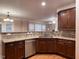 Well-equipped kitchen with stainless steel appliances, granite countertops, and a view of the breakfast nook at 102 Revere Forest Ct, Cary, NC 27519