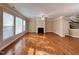 Cozy living room with fireplace, fan and bright windows offering natural light at 102 Revere Forest Ct, Cary, NC 27519