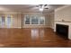 Bright living room with a cozy fireplace, and doors leading to outdoor space at 102 Revere Forest Ct, Cary, NC 27519