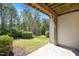 Back patio overlooks green space and shrubbery perfect for enjoying the outdoor scenery at 103 Ballyliffen Ln, Cary, NC 27519