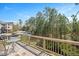 Balcony overlooking green space with table and chairs set for relaxing with a great view at 103 Ballyliffen Ln, Cary, NC 27519