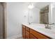 Bathroom with double vanity sinks, large mirror, and walk-in shower at 103 Ballyliffen Ln, Cary, NC 27519