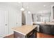 Bright kitchen view with central island and granite countertops at 103 Ballyliffen Ln, Cary, NC 27519
