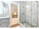 Modern bathroom with a glass-enclosed shower and elegant marble tiling at 103 Patriot Way, Apex, NC 27523