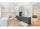 Stunning bathroom boasts dual vanity, soaking tub, glass shower, and stone accent fireplace feature at 103 Patriot Way, Apex, NC 27523