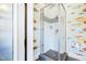 Stylish bathroom with unique wallpaper, a glass-enclosed shower, and modern fixtures at 103 Patriot Way, Apex, NC 27523