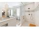 Spacious bathroom features a soaking tub, walk-in shower, and access to walk-in closet at 103 Patriot Way, Apex, NC 27523