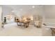 Open bonus room with plenty of cabinet storage, a large table, and access to the outside patio at 103 Patriot Way, Apex, NC 27523