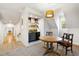 Cozy bonus room with a wet bar, a round table, and a view of the window at 103 Patriot Way, Apex, NC 27523