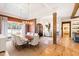 This dining room boasts natural light, modern chandelier, and direct access to the foyer at 103 Patriot Way, Apex, NC 27523