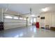 Spacious and well-lit garage with ample storage and an automatic door opener at 103 Patriot Way, Apex, NC 27523