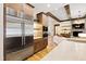 Modern kitchen with stainless steel appliances, custom cabinetry, and access to a living area at 103 Patriot Way, Apex, NC 27523