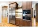 Gourmet kitchen features custom cabinetry, stainless steel appliances, and a built in oven at 103 Patriot Way, Apex, NC 27523