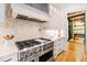 This modern kitchen features stainless steel appliances, custom backsplash and a wine cellar at 103 Patriot Way, Apex, NC 27523