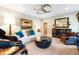 Cozy living room with plush seating, accent lighting and unique decor at 103 Patriot Way, Apex, NC 27523
