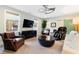 Comfortable living room area with large window, comfortable seating and accent lighting at 103 Patriot Way, Apex, NC 27523