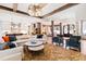 The spacious living room showcases wood beams, modern lighting, and open floor plan at 103 Patriot Way, Apex, NC 27523