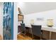Charming office space featuring a built-in desk, stylish chairs, and decorative elements at 103 Patriot Way, Apex, NC 27523