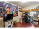 Bedroom with loft bed and desk; decorated with modern tapestry and gaming chair at 106 Northwinds Dr, Wendell, NC 27591