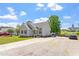 Charming single-story home with gray siding, a spacious driveway, and a well-manicured lawn at 106 Northwinds Dr, Wendell, NC 27591