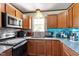 Well-equipped kitchen boasting stainless steel appliances, granite counters, and ample cabinet space at 106 Northwinds Dr, Wendell, NC 27591
