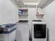 This laundry room features a set of white Samsung washing machine and dryer along with shelving at 106 Northwinds Dr, Wendell, NC 27591