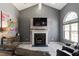 Bright living room featuring a fireplace, high ceilings, and an open floor plan at 106 Northwinds Dr, Wendell, NC 27591