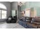Comfortable living room features high ceilings, a ceiling fan, and two leather couches at 106 Northwinds Dr, Wendell, NC 27591