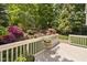 Landscaped backyard with terraced garden and wooden deck, perfect for outdoor entertaining at 107 Oxford Creek Rd, Cary, NC 27519