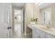 Bright bathroom featuring a vanity, granite countertop, mirror, and doorway into bedroom at 107 Oxford Creek Rd, Cary, NC 27519