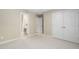 Bedroom featuring neutral carpet, double closet and doorways to bathroom at 107 Oxford Creek Rd, Cary, NC 27519