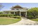 Charming home with a covered front porch, well-manicured lawn, and attractive landscaping at 107 Oxford Creek Rd, Cary, NC 27519