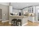 Spacious kitchen with granite counters, stainless steel appliances, and bar seating, perfect for entertaining at 107 Oxford Creek Rd, Cary, NC 27519