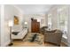 Cozy living room with hardwood floors, neutral tones, and comfortable seating, perfect for relaxation at 107 Oxford Creek Rd, Cary, NC 27519