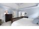 Comfortable main bedroom featuring tray ceiling, soft carpet, and bright, light-filled windows at 107 Oxford Creek Rd, Cary, NC 27519