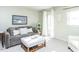 This is a living room with gray sofa, neutral walls, and light-colored carpet at 11 Whitburn Pl, Durham, NC 27705