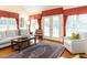 Spacious living room with large windows, hardwood floors, and comfortable seating at 11 Whitburn Pl, Durham, NC 27705