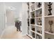 Upstairs hallway with built-in bookshelves and views of the staircase and entry chandelier at 112 Aspenridge Dr, Holly Springs, NC 27540