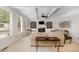 Bright living room features coffered ceilings, built-in shelving, and large windows at 112 Aspenridge Dr, Holly Springs, NC 27540