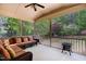 Relaxing screened porch with comfortable seating offers peaceful views of the backyard at 112 Aspenridge Dr, Holly Springs, NC 27540