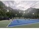Community tennis court with night lighting available for evening play at 112 Aspenridge Dr, Holly Springs, NC 27540