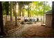 Backyard featuring a fire pit, outdoor kitchen, grill and lounge chairs at 112 E Edgewood Dr, Durham, NC 27704