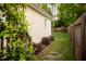 Manicured backyard with a stone pathway and established trees at 112 E Edgewood Dr, Durham, NC 27704