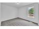 Cozy bedroom with plush carpeting and a bright window overlooking the neighborhood at 112 Edmondson Dr, Willow Springs, NC 27592