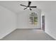 Inviting bedroom features a high ceiling, arched window, and neutral carpet at 112 Edmondson Dr, Willow Springs, NC 27592