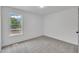This bedroom has neutral carpet with a bright window at 112 Edmondson Dr, Willow Springs, NC 27592