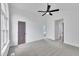 Bedroom with carpet and purple painted doors; bathroom and closet can be accessed from here at 112 Edmondson Dr, Willow Springs, NC 27592