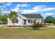 Charming home featuring a covered porch, white picket fence and well-manicured lawn at 112 Edmondson Dr, Willow Springs, NC 27592