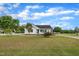 Charming single-story home boasting a lovely front porch, green lawn, and blue front door at 112 Edmondson Dr, Willow Springs, NC 27592