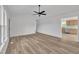 Open living area showcases neutral walls, durable hard surface floors, and views into adjacent kitchen at 112 Edmondson Dr, Willow Springs, NC 27592
